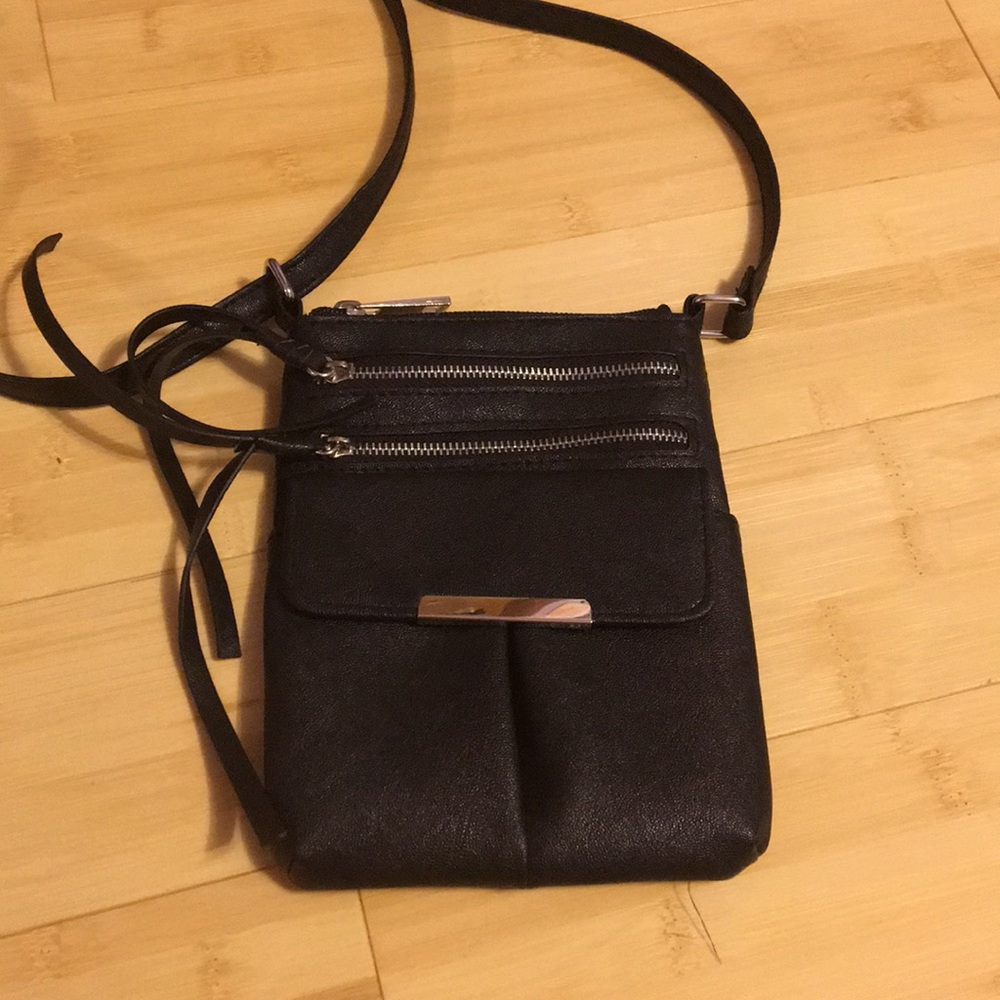 Small black crossbody purse.